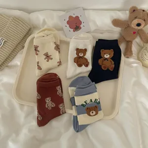 Detailed view of cute cartoon teddy bear mid-calf socks with soft plush design and cozy fabric.