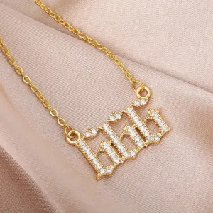 Close-up detail of the fashion rhinestone angel number necklace, gleaming gold chain and pendant.