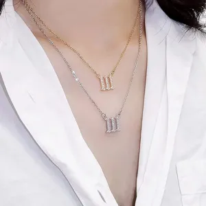 Detailed closeup of the rhinestone angel number layered necklace with sparkling crystal details.