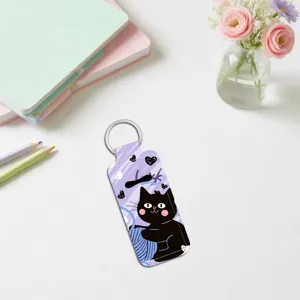 Cute black cat neoprene lipstick holder keychain detail view, portable lip balm case charm.