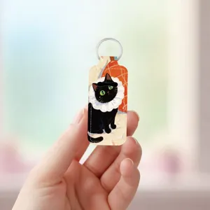 Neoprene lipstick holder keychain with black cat print, portable lip balm pouch pendant.