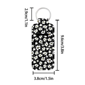 Floral lipstick holder keychain with black daisy print and metal ring for easy daily carry.