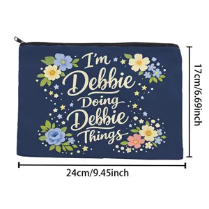 Canvas cosmetic bag with floral print and letter design, practical travel storage pouch.