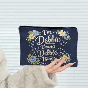 Blue cosmetic makeup bag with floral print and custom text design for daily travel storage.