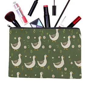 Green canvas cosmetic pouch with cute duck and daisy pattern, ideal travel makeup bag for women.