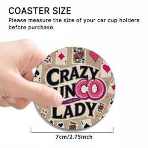 Close-up detail of round car cup coaster with card pattern, showing texture and size clearly.