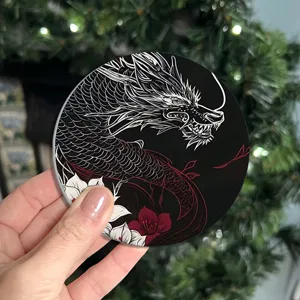 Close-up of a creative acrylic car coaster featuring a striking oriental dragon and floral art.