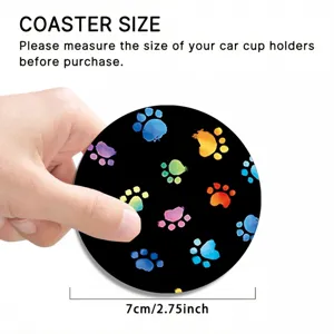 Detailed view of black car cup holder coaster featuring vibrant colorful watercolor paw prints.