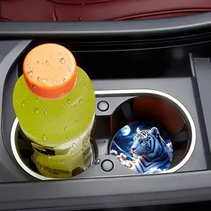 Close-up of car cup holder coaster featuring a majestic white tiger design in vehicle.