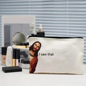 Trousse de maquillage blanche en toile avec impression drôle de Jésus et fermeture.