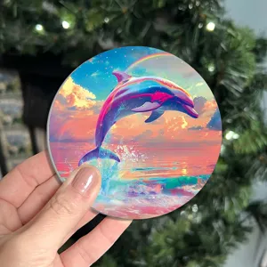 Round car cup coaster featuring vibrant dolphin and rainbow sunset print, waterproof detail view.