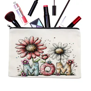 Close-up detail of a white canvas cosmetic pouch featuring floral MOM watercolor print.