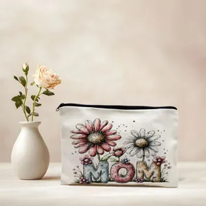 Detailed view of canvas cosmetic bag featuring watercolor floral MOM design with zipper.