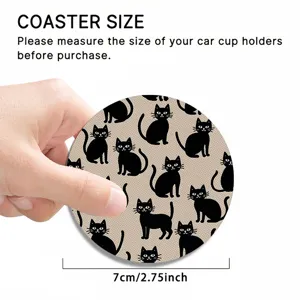 Close-up detail of black cat pattern car coaster with 7cm diameter and durable silicone material.