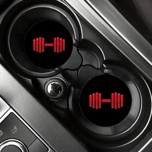 Car cup coasters for vehicle interior, anti-slip rubber drink holder inserts with red dumbbell design.