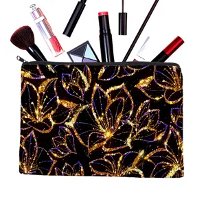 Black canvas zipper pouch with gold glitter floral print, versatile cosmetic bag and pencil case.