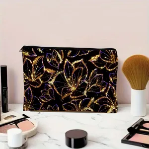 Canvas cosmetic bag with gold glitter floral pattern zipper pouch for travel makeup storage.