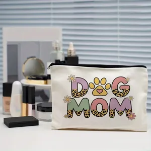 Canvas makeup bag detail shot, cute dog mom print design, portable cosmetic storage pouch.