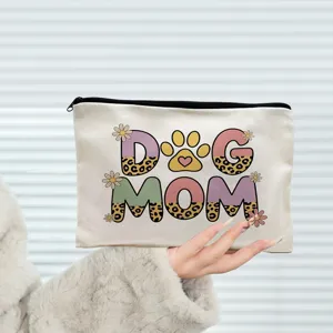 Detailed view of canvas cosmetic bag zipper pouch featuring trendy dog mom letter print for daily use.