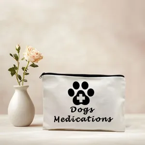 White canvas zipper pouch detail showing pet medicine storage print with cute paw design.