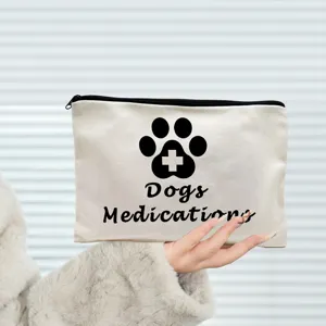 Canvas zipper pouch detail view, portable makeup cosmetic bag with cute dog medication print.