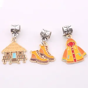 Detailed shot of cute DIY enamel alloy charms including hut, boots, and raincoat pendant designs.