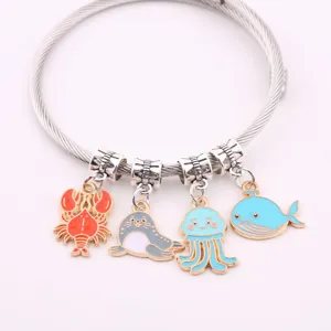 Ocean animal charm bracelet featuring cute lobster seal jellyfish and whale alloy pieces.