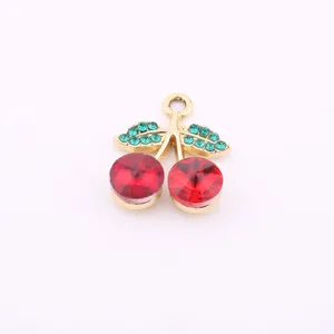 Detailed view of gold-plated red crystal cherry pendant, DIY jewelry making accessory.