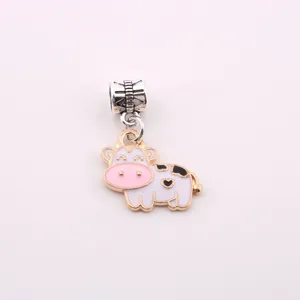 Cute enamel cow charm pendant, alloy DIY jewelry accessory detail for bracelets.