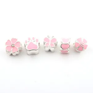 Silver pink enamel DIY charm beads set, close-up details of flower and butterfly styles.