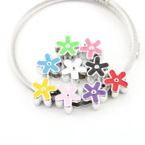 Close-up of DIY flower large-hole beads charm bracelet accessory with colorful enamel finish.