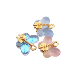 Colorful glass butterfly charms with gold metal accents for DIY jewelry making and necklaces.
