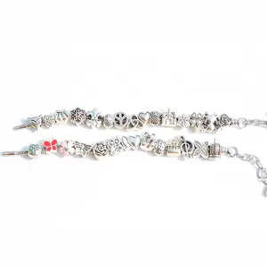 DIY silver charm bracelet snake chain with assorted metal beads, vintage style jewelry making.