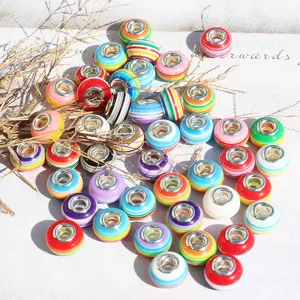 Detailed view of colorful striped resin large-hole charm beads, perfect for DIY bracelets.