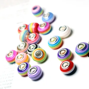 Colorful striped resin large hole beads for DIY charm bracelets and jewelry making accessories.