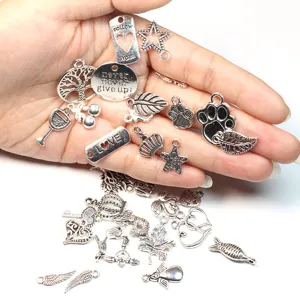 Antique silver alloy DIY jewelry charms assortment, crown, star and heart pendants.