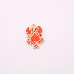 Close-up detail of the red and gold crab pendant, perfect for DIY jewelry making and charms.