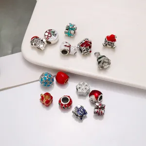 Christmas DIY alloy charm beads detail shot, colorful enamel holiday jewelry making accessories.