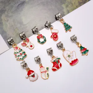 Close-up of assorted Christmas alloy oil-drop charms, featuring cute holiday designs for DIY jewelry.
