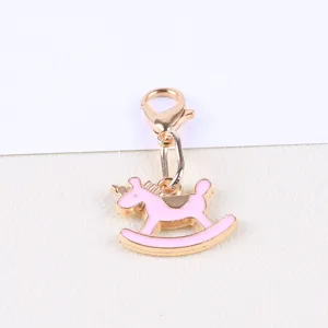 Cute pink rocking horse charm pendant with gold lobster clasp for DIY jewelry making.