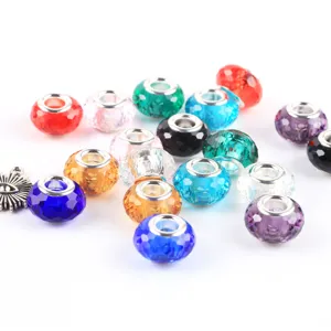 Detailed close-up of colorful faceted glass large hole charm beads for DIY European bracelets.