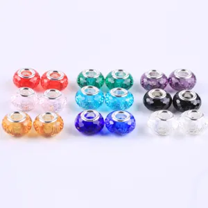 Closeup of colorful faceted glass charm beads with metal core for DIY European bracelets