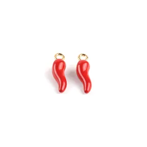 Close-up of red enamel chili pepper charms with gold loops for DIY jewelry making.