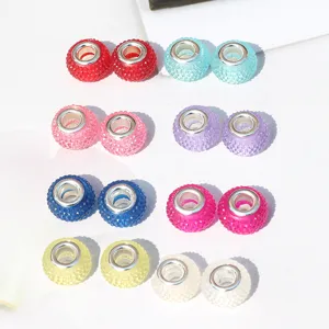 Colorful resin large hole beads for DIY jewelry, detailed close-up view of sparkling beads.