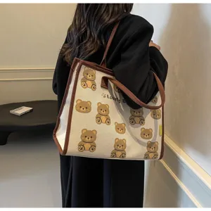 Vue détaillée du sac cabas en toile avec imprimé d'ours mignon, grand sac fourre-tout décontracté.