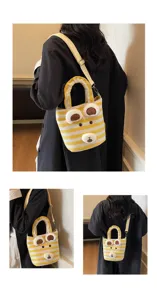 Detailed view of the cute striped plush bear tote bag, showing crossbody and shoulder wear.