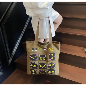 Sac cabas en toile avec joli imprimé de chat noir, sac à épaule spacieux pour le quotidien.