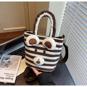 Cute striped canvas shoulder bag with adorable 3D bear face design for autumn and winter casual wear.