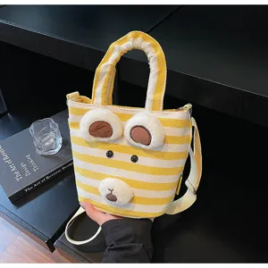 Cute striped canvas bucket bag with plush bear ears, casual shoulder tote for women and girls.