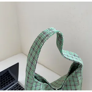 Green plaid tweed shoulder bag detail view, casual retro underarm bag for women autumn style.